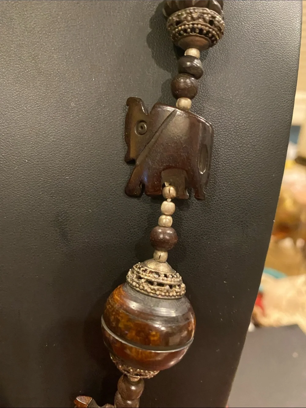 Handcrafted Elephant Pendant Necklace - Brown. Small elephants are bone.